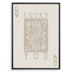 Load image into Gallery viewer, Framed minimalist “Lucky You” poster featuring Queen of Hearts playing card design in beige tones on a neutral background.
