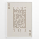 Load image into Gallery viewer, Framed minimalist “Lucky You” poster featuring Queen of Hearts playing card design in beige tones on a neutral background.
