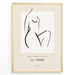 Load image into Gallery viewer, Framed La Femme poster featuring minimalist female silhouette line art in black on a beige background with modern typography.

