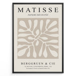 Load image into Gallery viewer, Framed Matisse Papiers Découpés poster with abstract beige cut-out shapes and black typography on a neutral background.
