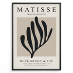 Load image into Gallery viewer, Framed Matisse Papiers Découpés poster featuring black abstract botanical shapes on a beige background with Berggruen &amp; Cie text.
