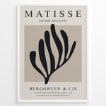 Load image into Gallery viewer, Framed Matisse Papiers Découpés poster featuring black abstract botanical shapes on a beige background with Berggruen &amp; Cie text.
