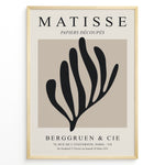 Load image into Gallery viewer, Framed Matisse Papiers Découpés poster featuring black abstract botanical shapes on a beige background with Berggruen &amp; Cie text.
