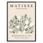 Load image into Gallery viewer, Framed Matisse-style botanical poster with abstract green and white leaf cutout shapes and beige background, titled “Papiers Découpés.”
