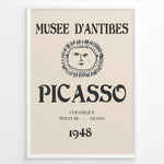Load image into Gallery viewer, Framed Picasso Musée d’Antibes 1948 exhibition poster with a minimalist face illustration and vintage typography on a beige background.
