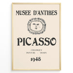 Load image into Gallery viewer, Framed Picasso Musée d’Antibes 1948 exhibition poster with a minimalist face illustration and vintage typography on a beige background.
