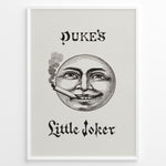 Load image into Gallery viewer, Framed Duke’s Little Joker vintage poster with detailed moon face illustration smoking a cigarette on a beige textured background.
