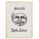 Load image into Gallery viewer, Framed Duke’s Little Joker vintage poster with detailed moon face illustration smoking a cigarette on a beige textured background.
