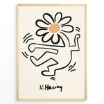 Load image into Gallery viewer, Framed Keith Haring-style poster showing a black outlined dancing figure with a daisy flower head on a beige background.
