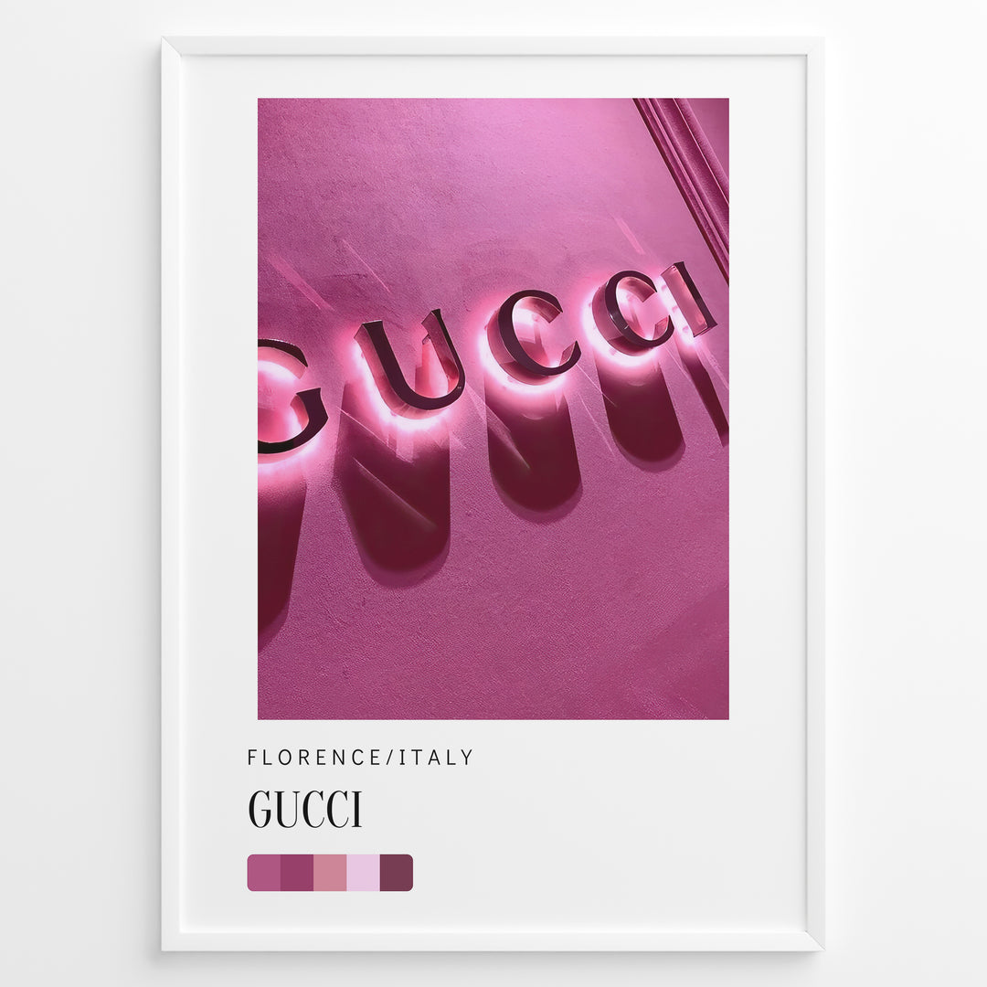 Fashion Plakat | Gucci Storefront Wall Art – Florence Italy Plakaty.dk | Gucci logo in glowing pink neon lights on a textured wall in Florence, Italy, with a modern color palette and shadows creating a bold visual effect.
