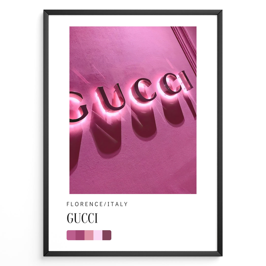 Fashion Plakat | Gucci Storefront Wall Art – Florence Italy Plakaty.dk | Gucci logo in glowing pink neon lights on a textured wall in Florence, Italy, with a modern color palette and shadows creating a bold visual effect.