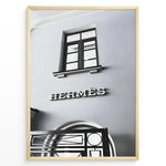 Load image into Gallery viewer, Fashion Plakat | Hermès Storefront Minimalist Poster – Black &amp; White Fashion Wall Art Plakaty.dk | Black and white photo of the Hermès storefront with a clean minimalist facade, showing a window above the iconic logo and part of an ornate entryway gate.
