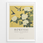 Load image into Gallery viewer, Japanske plakater | Japanese woodblock print of white trumpet lilies with green leaves and two sparrows flying against a yellow background, based on Hokusai’s  floral artwork.
