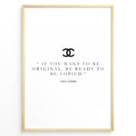 Load image into Gallery viewer, Fashion Plakat | Inspirational Coco Chanel Quote Wall Art Plakaty.dk | Black and white framed print with the quote “If you want to be original, be ready to be copied” by Coco Chanel, featuring the Chanel logo.

