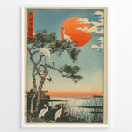 Load image into Gallery viewer, Japanske plakater |  Japanese ukiyo-e style art print of white cranes with a pine tree and a vivid red sun over a tranquil lakeside, framed in black.
