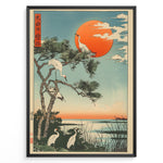 Load image into Gallery viewer, Japanske plakater |  Japanese ukiyo-e style art print of white cranes with a pine tree and a vivid red sun over a tranquil lakeside, framed in black.
