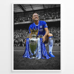 Load image into Gallery viewer, John Terry wearing a Chelsea football jersey with the Premier League trophy in front of the Chelsea supporters. The iconic blue colors stand out against the black and white stadium background.
