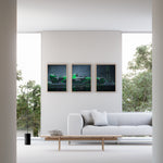 Load image into Gallery viewer, Triptych wall art plakat of the Kick Sauber F1 Team C44 Formula 1 car in a sleek black-and-green livery, displayed in a modern living room with black leather furniture.
