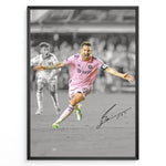 Load image into Gallery viewer, Plakat of Lionel Messi celebrating a goal in pink Inter Miami jersey, arms spread wide, with printed signature and black-and-white background.
