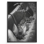 Load image into Gallery viewer, Fashion Plakat | Luxurious Cartier-Inspired Art Featuring Leopard on Velvet Sofa Plakaty.dk | Black-and-white image of a leopard lying on its back on a tufted velvet sofa, with the word &quot;Cartier&quot; elegantly overlaid at the top.
