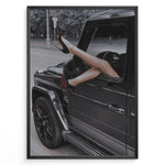 Load image into Gallery viewer, Fashion Plakat | Luxury Escape: Legs in High Heels Through Mercedes G-Wagon Window Plakaty.dk | Woman&#39;s legs in high heels sticking out of a Mercedes-Benz G-Wagon window in an urban street scene.
