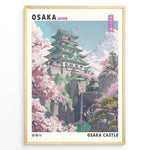 Load image into Gallery viewer, Japanske plakater | Colorful illustration of Osaka Castle in Japan, surrounded by cherry blossom trees, rocky cliffs, and a waterfall with distant mountains under a blue sky.
