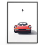 Load image into Gallery viewer, Framed minimalist poster of a red Ferrari Dino 246 GT classic sports car front view with black Ferrari prancing horse logo above.
