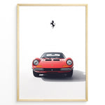 Load image into Gallery viewer, Framed minimalist poster of a red Ferrari Dino 246 GT classic sports car front view with black Ferrari prancing horse logo above.
