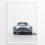 Load image into Gallery viewer, Front view illustration of a classic silver Aston Martin DB5 on a minimal white background.
