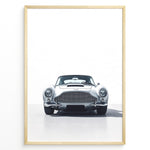 Load image into Gallery viewer, Front view illustration of a classic silver Aston Martin DB5 on a minimal white background.
