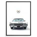 Load image into Gallery viewer, Front-facing illustration of a white classic convertible car with an emblem above in a minimalist framed poster.
