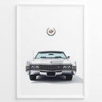 Load image into Gallery viewer, Front-facing illustration of a white classic convertible car with an emblem above in a minimalist framed poster.
