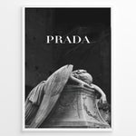 Load image into Gallery viewer, Fashion Plakat | Prada-Inspired Angel Statue – Fashion and Art Black and White Poster Plakaty.dk | Black and white artwork of a mourning angel statue with the word &quot;PRADA&quot; above, blending classical art and modern fashion
