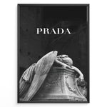 Load image into Gallery viewer, Fashion Plakat | Prada-Inspired Angel Statue – Fashion and Art Black and White Poster Plakaty.dk | Black and white artwork of a mourning angel statue with the word &quot;PRADA&quot; above, blending classical art and modern fashion
