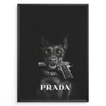 Load image into Gallery viewer, Fashion Plakat | Prada-Inspired Art Featuring Fierce Dog with Gun Plakaty.dk | Black Doberman with a studded collar holding a handgun in its mouth, set against a dark background with the word &quot;PRADA&quot; in bold white text.
