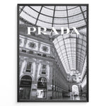 Load image into Gallery viewer, Fashion Plakat | Prada Boutique in Galleria Vittorio Emanuele II – Milan, Italy Plakaty.dk | Black and white photo of the Prada store inside the Galleria Vittorio Emanuele II in Milan, showcasing ornate architecture and a large glass-domed ceiling.
