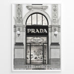 Load image into Gallery viewer, Fashion Plakat | Prada Storefront Wall Art – Italian Luxury Boutique Print Plakaty.dk | Black and white photo of the Prada Milano storefront with arched windows and detailed classical architecture.
