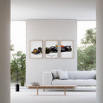Load image into Gallery viewer, Triptych wall art plakat of the Red Bull Racing RB20 Formula 1 car displayed in a contemporary living room with a black leather sofa and modern furnishings.
