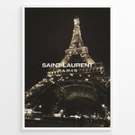 Load image into Gallery viewer, Fashion Plakat | Saint Laurent Eiffel Tower Night View – Paris Fashion Wall Art Plakaty.dk | Illuminated Eiffel Tower at night with &quot;Saint Laurent Paris&quot; logo centered in white text.

