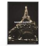 Load image into Gallery viewer, Fashion Plakat | Saint Laurent Eiffel Tower Night View – Paris Fashion Wall Art Plakaty.dk | Illuminated Eiffel Tower at night with &quot;Saint Laurent Paris&quot; logo centered in white text.
