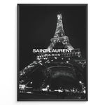 Load image into Gallery viewer, Fashion Plakat | Saint Laurent Eiffel Tower Poster – Black &amp; White Paris Fashion Print Plakaty.dk | Black and white photo of the Eiffel Tower illuminated at night with “Saint Laurent Paris” text overlay, capturing the essence of French fashion and elegance.

