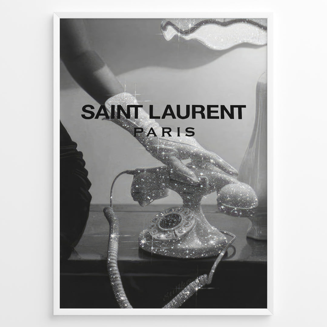 Fashion Plakat | Saint Laurent Glamour Art Featuring Glitter Phone and Elegant Hand Plakaty.dk | Black-and-white image of a sparkling vintage rotary phone being held by a glittering, elegant hand, with "SAINT LAURENT PARIS" overlaid in bold text.