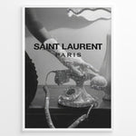 Load image into Gallery viewer, Fashion Plakat | Saint Laurent Glamour Art Featuring Glitter Phone and Elegant Hand Plakaty.dk | Black-and-white image of a sparkling vintage rotary phone being held by a glittering, elegant hand, with &quot;SAINT LAURENT PARIS&quot; overlaid in bold text.
