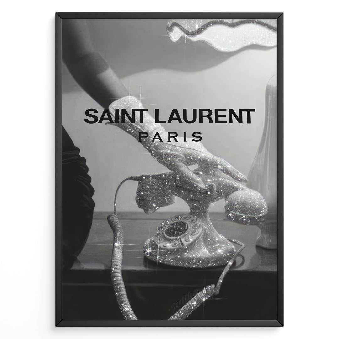 Fashion Plakat | Saint Laurent Glamour Art Featuring Glitter Phone and Elegant Hand Plakaty.dk | Black-and-white image of a sparkling vintage rotary phone being held by a glittering, elegant hand, with "SAINT LAURENT PARIS" overlaid in bold text.