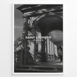 Load image into Gallery viewer, Fashion Plakat | Saint Laurent Paris – Architectural Elegance in Monochrome Plakaty.dk | Black and white photo of classical architecture with arches and columns, overlaid with the Saint Laurent Paris logo, conveying elegance and luxury.
