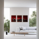 Load image into Gallery viewer, Triptych wall art plakat featuring the Scuderia Ferrari SF-24 Formula 1 car in a modern black-and-white living room with leather furniture.
