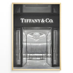 Load image into Gallery viewer, Fashion Plakat | Tiffany &amp; Co. Entrance – Luxury Jewelry Store Poster in Black &amp; White Plakaty.dk | Black and white photo of the Tiffany &amp; Co. boutique entrance with glass doors, a chandelier inside, and the illuminated brand name above.
