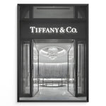Load image into Gallery viewer, Fashion Plakat | Tiffany &amp; Co. Entrance – Luxury Jewelry Store Poster in Black &amp; White Plakaty.dk | Black and white photo of the Tiffany &amp; Co. boutique entrance with glass doors, a chandelier inside, and the illuminated brand name above.
