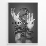 Load image into Gallery viewer, Fashion Plakat | Versace-Inspired Art Featuring Serpent and Marble Hands Plakaty.dk | Black-and-white image of a snake wrapped around two upward-reaching marble-textured hands, with the word &quot;VERSACE&quot; overlaid in bold, semi-blurred text.
