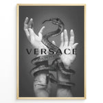 Load image into Gallery viewer, Fashion Plakat | Versace-Inspired Art Featuring Serpent and Marble Hands Plakaty.dk | Black-and-white image of a snake wrapped around two upward-reaching marble-textured hands, with the word &quot;VERSACE&quot; overlaid in bold, semi-blurred text.
